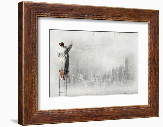 Businesswoman Standing on Ladder and Drawing Sketch on Wall-Sergey Nivens-Framed Photographic Print