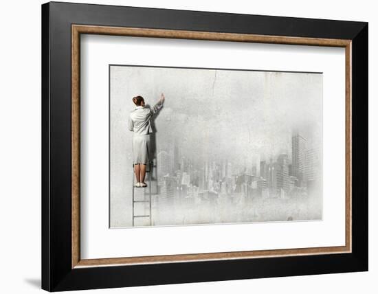 Businesswoman Standing on Ladder and Drawing Sketch on Wall-Sergey Nivens-Framed Photographic Print