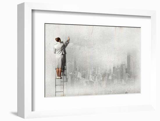 Businesswoman Standing on Ladder and Drawing Sketch on Wall-Sergey Nivens-Framed Photographic Print