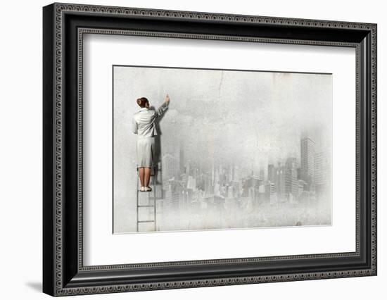 Businesswoman Standing on Ladder and Drawing Sketch on Wall-Sergey Nivens-Framed Photographic Print