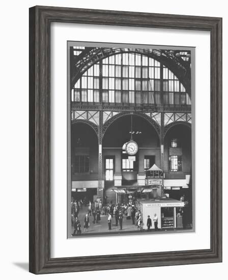 Bustling Interior Showing Digital and Standard Clocks and Ironwork Arches of Penn Station-Walker Evans-Framed Photographic Print