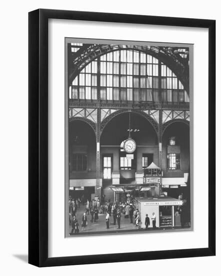 Bustling Interior Showing Digital and Standard Clocks and Ironwork Arches of Penn Station-Walker Evans-Framed Photographic Print