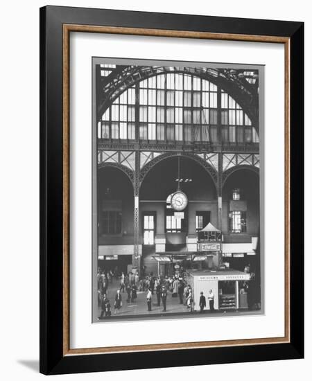 Bustling Interior Showing Digital and Standard Clocks and Ironwork Arches of Penn Station-Walker Evans-Framed Photographic Print