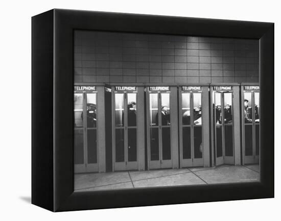 Busy Telephone Booths During an Airline Strike-Robert W^ Kelley-Framed Premier Image Canvas
