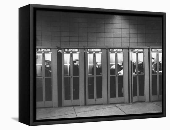 Busy Telephone Booths During an Airline Strike-Robert W^ Kelley-Framed Premier Image Canvas