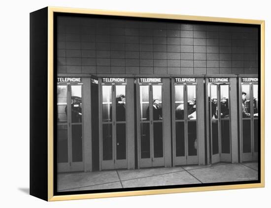 Busy Telephone Booths During an Airline Strike-Robert W^ Kelley-Framed Premier Image Canvas