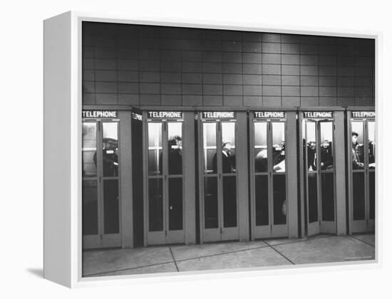 Busy Telephone Booths During an Airline Strike-Robert W^ Kelley-Framed Premier Image Canvas