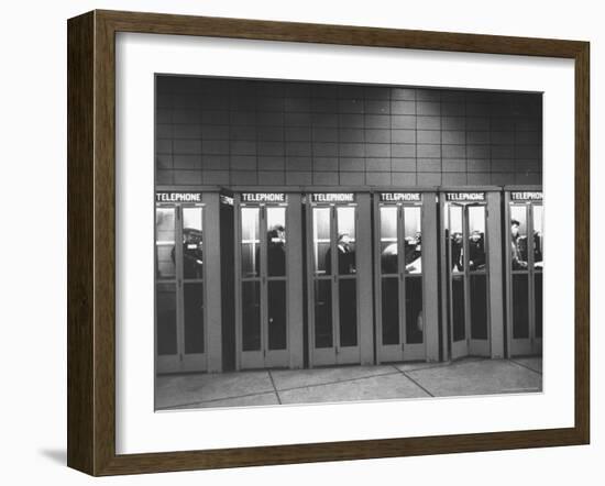 Busy Telephone Booths During an Airline Strike-Robert W^ Kelley-Framed Photographic Print