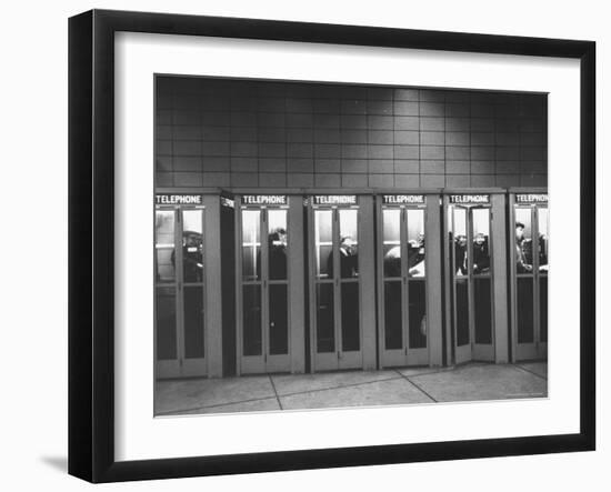 Busy Telephone Booths During an Airline Strike-Robert W^ Kelley-Framed Photographic Print