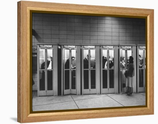 Busy Telephone Booths During an Airline Strike-Robert W^ Kelley-Framed Premier Image Canvas