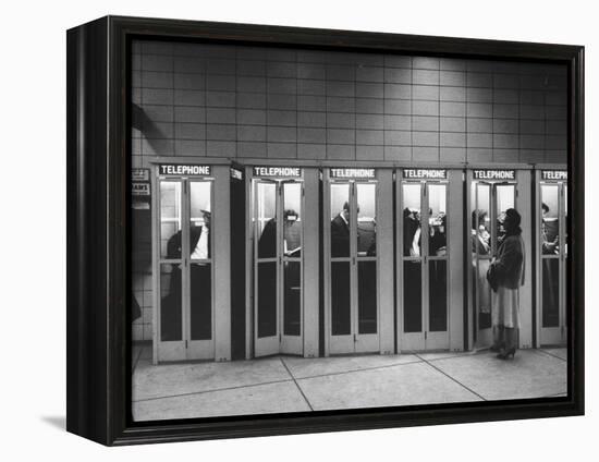 Busy Telephone Booths During an Airline Strike-Robert W^ Kelley-Framed Premier Image Canvas