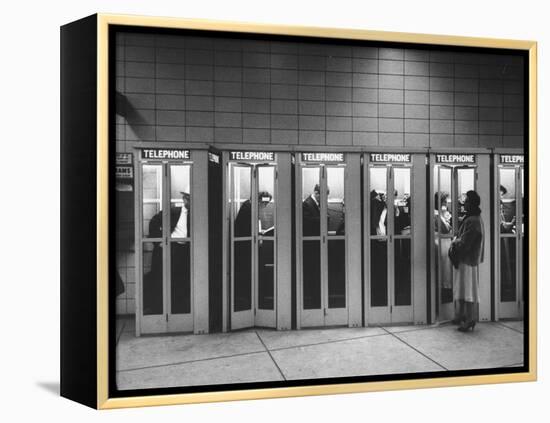 Busy Telephone Booths During an Airline Strike-Robert W^ Kelley-Framed Premier Image Canvas