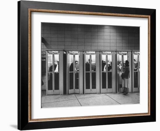 Busy Telephone Booths During an Airline Strike-Robert W^ Kelley-Framed Photographic Print