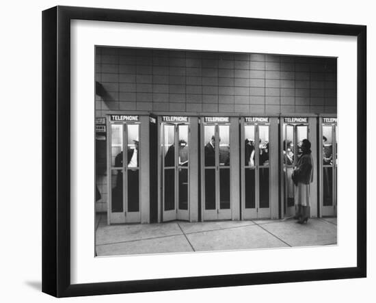 Busy Telephone Booths During an Airline Strike-Robert W^ Kelley-Framed Photographic Print