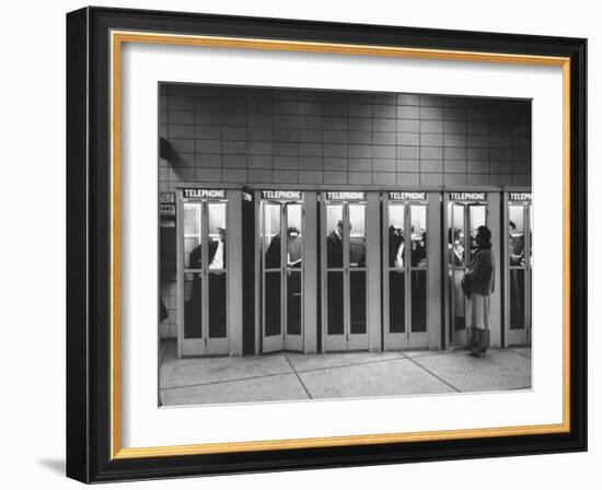 Busy Telephone Booths During an Airline Strike-Robert W^ Kelley-Framed Photographic Print