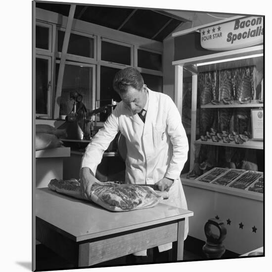 Butcher from Danish Bacon Giving a Demonstration, Kilnhurst, South Yorkshire, 1961-Michael Walters-Mounted Photographic Print