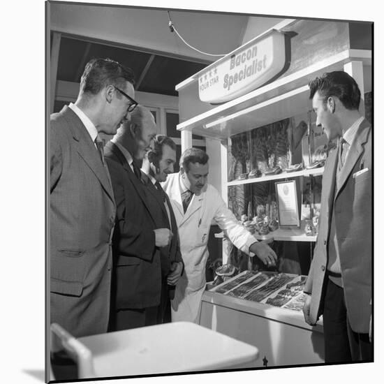Butcher from Danish Bacon Giving a Demonstration, Kilnhurst, South Yorkshire, 1961-Michael Walters-Mounted Photographic Print