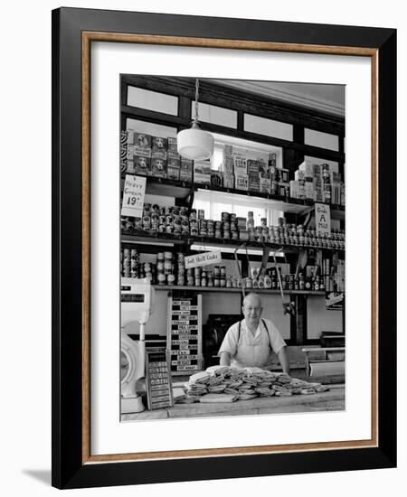 Butcher Standing at Meat Counter of Deli-Alfred Eisenstaedt-Framed Photographic Print