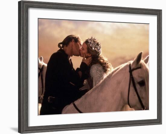 Buttercup and Westley Kissing on Horseback-null-Framed Photo