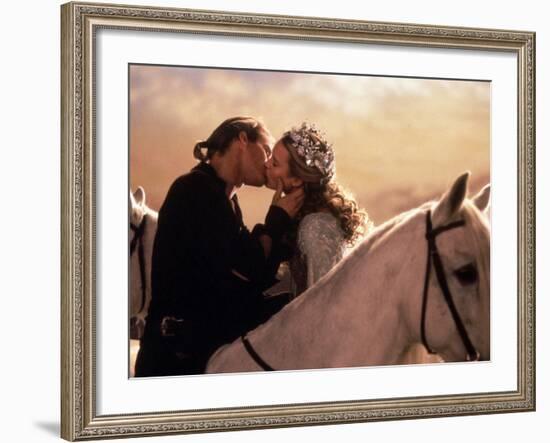 Buttercup and Westley Kissing on Horseback-null-Framed Photo