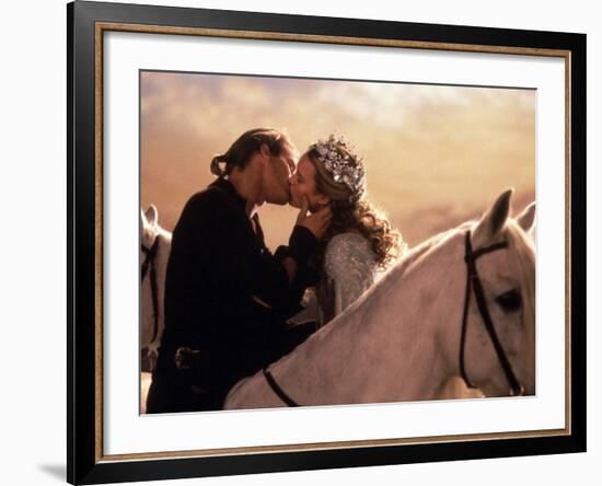 Buttercup and Westley Kissing on Horseback-null-Framed Photo