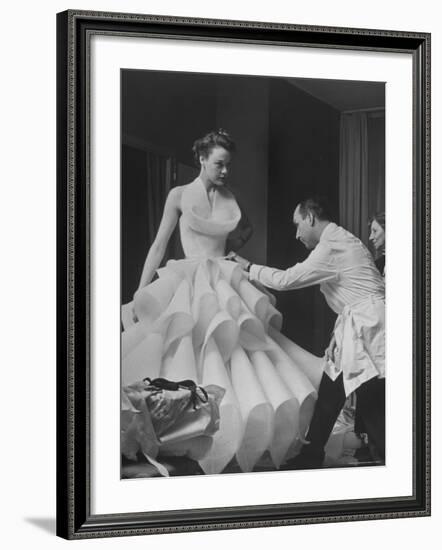 Buyer Sampling an Evening Dress on a Model to Check Its Quality-Nat Farbman-Framed Photographic Print