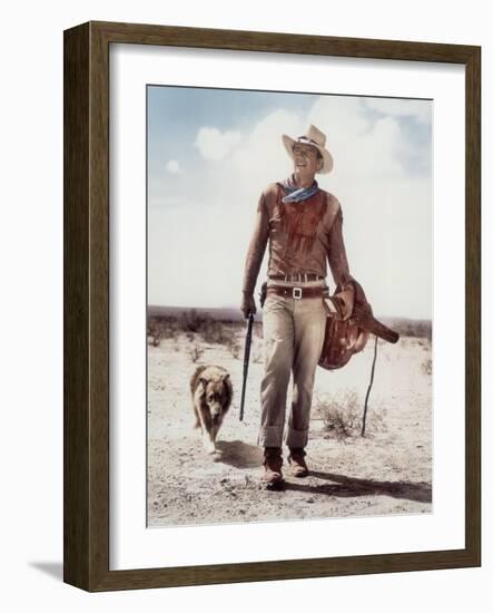 ca., 1953 --- Actor John Wayne on the movie set of "Hondo" (Hondo, L'Homme du Desert), directed by-null-Framed Photo