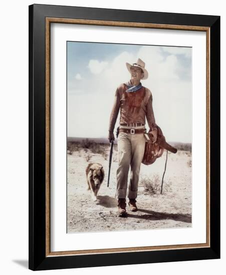 ca., 1953 --- Actor John Wayne on the movie set of "Hondo" (Hondo, L'Homme du Desert), directed by-null-Framed Photo