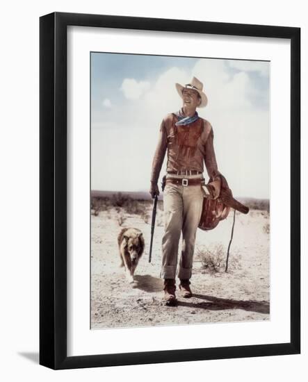 ca., 1953 --- Actor John Wayne on the movie set of "Hondo" (Hondo, L'Homme du Desert), directed by-null-Framed Photo