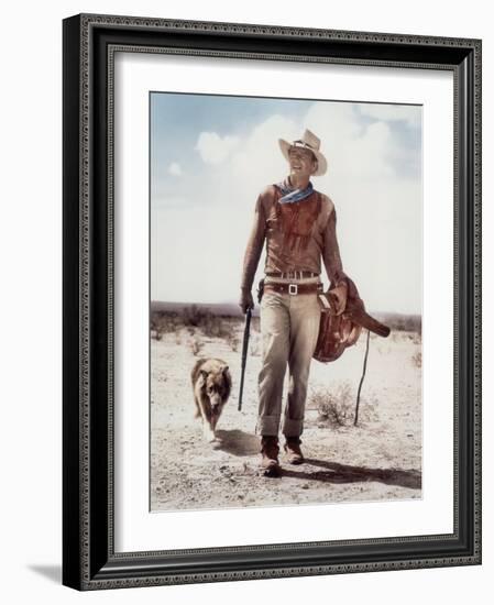 ca., 1953 --- Actor John Wayne on the movie set of "Hondo" (Hondo, L'Homme du Desert), directed by-null-Framed Photo