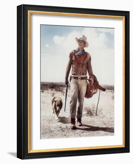 ca., 1953 --- Actor John Wayne on the movie set of "Hondo" (Hondo, L'Homme du Desert), directed by-null-Framed Photo