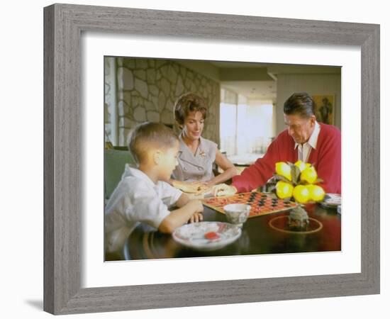 CA Gov. Candidate Ronald Reagan, Wife Nancy and Son Sitting at Table Playing Checkers at Home-Bill Ray-Framed Photographic Print