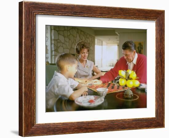 CA Gov. Candidate Ronald Reagan, Wife Nancy and Son Sitting at Table Playing Checkers at Home-Bill Ray-Framed Photographic Print