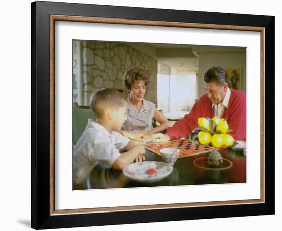 CA Gov. Candidate Ronald Reagan, Wife Nancy and Son Sitting at Table Playing Checkers at Home-Bill Ray-Framed Photographic Print
