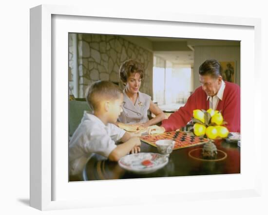 CA Gov. Candidate Ronald Reagan, Wife Nancy and Son Sitting at Table Playing Checkers at Home-Bill Ray-Framed Photographic Print