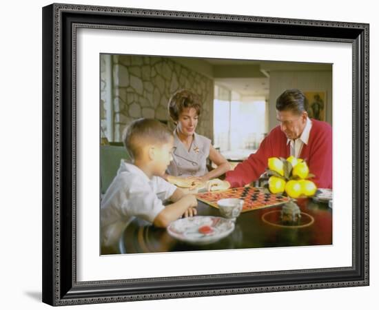 CA Gov. Candidate Ronald Reagan, Wife Nancy and Son Sitting at Table Playing Checkers at Home-Bill Ray-Framed Photographic Print