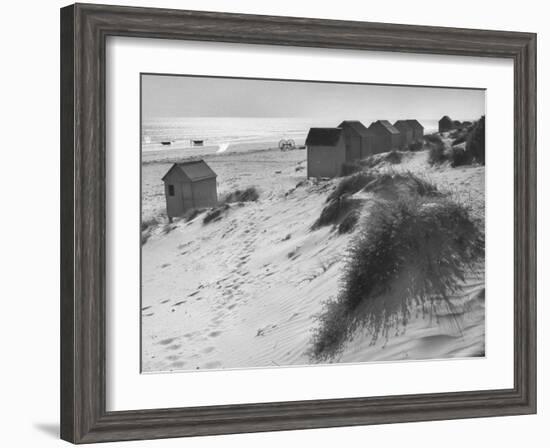 Cabanas Sitting on Sand Dunes with Clumps of Sea Grass Next to Rowboats-Eliot Elisofon-Framed Photographic Print