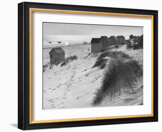Cabanas Sitting on Sand Dunes with Clumps of Sea Grass Next to Rowboats-Eliot Elisofon-Framed Photographic Print