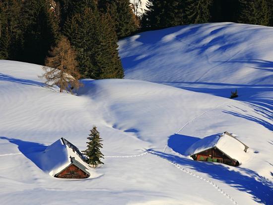 Cabins Nearly Covered in Snow in the German Alps 