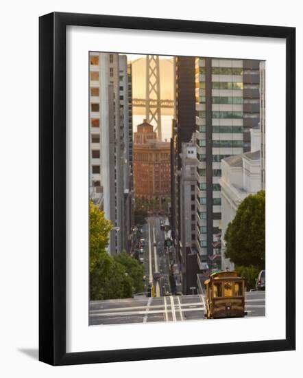 Cable Car Crossing California Street With Bay Bridge Backdrop in San Francisco, California, USA-Chuck Haney-Framed Photographic Print