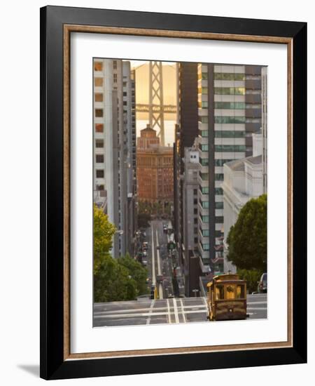 Cable Car Crossing California Street With Bay Bridge Backdrop in San Francisco, California, USA-Chuck Haney-Framed Photographic Print