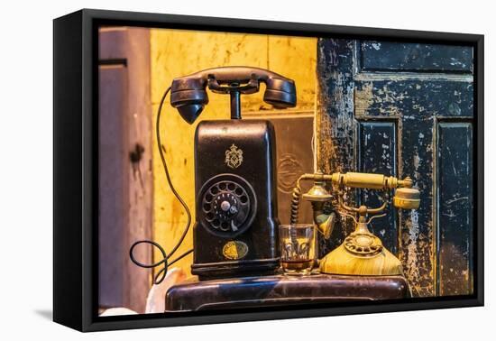 Cairo, Egypt. Antique telephones at a shop on El Moez street in Old Cairo.-Emily Wilson-Framed Premier Image Canvas