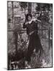 Calamity Jane at the Grave of Buffalo Bill in 1900-null-Mounted Photo