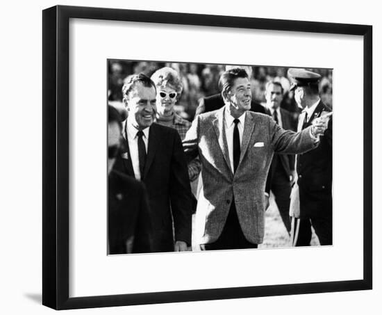 Calif Gov Ronald Reagan Escorts Pres-Elect Richard Nixon across Field at Halftime of Rose Bowl Game-null-Framed Photo