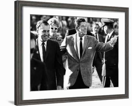 Calif Gov Ronald Reagan Escorts Pres-Elect Richard Nixon across Field at Halftime of Rose Bowl Game-null-Framed Photo