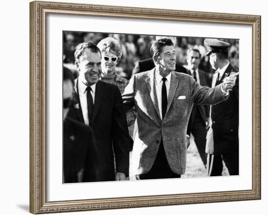 Calif Gov Ronald Reagan Escorts Pres-Elect Richard Nixon across Field at Halftime of Rose Bowl Game-null-Framed Photo