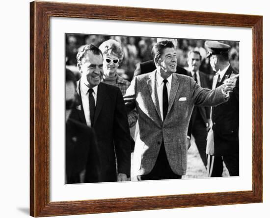 Calif Gov Ronald Reagan Escorts Pres-Elect Richard Nixon across Field at Halftime of Rose Bowl Game-null-Framed Photo