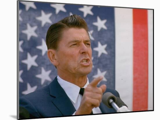 California Gubernatorial Candidate Ronald Reagan Speaking in Front of American Flag Backdrop-Bill Ray-Mounted Photographic Print
