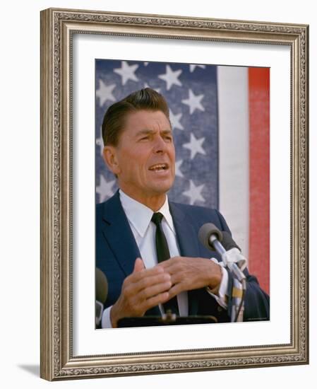 California Gubernatorial Candidate Ronald Reagan Speaking in Front of American Flag Backdrop-Bill Ray-Framed Photographic Print