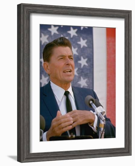 California Gubernatorial Candidate Ronald Reagan Speaking in Front of American Flag Backdrop-Bill Ray-Framed Photographic Print